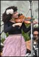 A person playing a violin

Description automatically generated