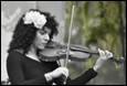 A person playing a violin

Description automatically generated