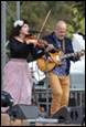 A person and person playing instruments

Description automatically generated