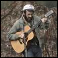 A person playing a guitar

Description automatically generated