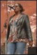 A person standing in front of a microphone

Description automatically generated