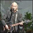 A person playing a guitar

Description automatically generated