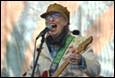 A person singing into a microphone

Description automatically generated