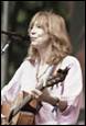 A person with a guitar

Description automatically generated