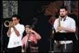 A group of people playing instruments

Description automatically generated with medium confidence