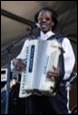 A person playing an accordion

Description automatically generated with medium confidence