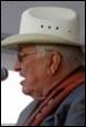 A person wearing a cowboy hat and glasses

Description automatically generated with low confidence