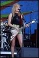 A person playing a guitar on stage

Description automatically generated with low confidence