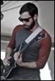 A person playing a guitar

Description automatically generated with medium confidence