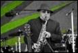 A person playing a saxophone

Description automatically generated