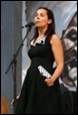 A person singing into a microphone

Description automatically generated with medium confidence