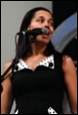 A person singing into a microphone

Description automatically generated with medium confidence