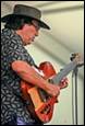 A person playing a guitar

Description automatically generated with medium confidence
