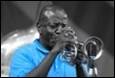 A person playing a trumpet

Description automatically generated with medium confidence