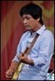 A person playing a guitar

Description automatically generated with medium confidence