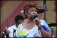 A person singing into a microphone

Description automatically generated