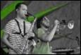 A couple of men playing instruments

Description automatically generated with low confidence