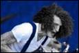 A picture containing person, clothing, concert, band

Description automatically generated