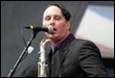 A person singing into a microphone

Description automatically generated