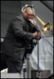 A person playing a trumpet

Description automatically generated with low confidence