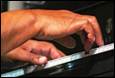 Close-up of a person playing a piano

Description automatically generated with medium confidence