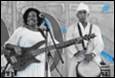 A person and person playing instruments

Description automatically generated with medium confidence