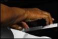 A close-up of a hand on a keyboard

Description automatically generated