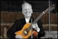 A person holding a guitar

Description automatically generated with medium confidence