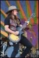A person playing a guitar

Description automatically generated with medium confidence