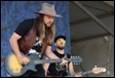 A group of men playing guitars

Description automatically generated with medium confidence