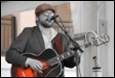A person playing a guitar

Description automatically generated with medium confidence