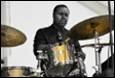 A person playing a drum set

Description automatically generated