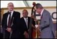 A group of men playing instruments

Description automatically generated with low confidence