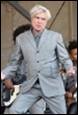 A person in a suit

Description automatically generated
