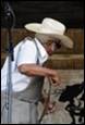 A person wearing a cowboy hat and sunglasses

Description automatically generated with low confidence