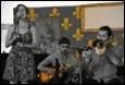 A group of people playing instruments

Description automatically generated with medium confidence