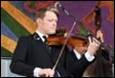A person playing a violin

Description automatically generated with low confidence