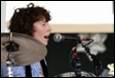 A person singing into a microphone

Description automatically generated with medium confidence