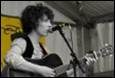 A person playing a guitar

Description automatically generated with low confidence