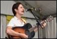 A person playing a guitar

Description automatically generated with medium confidence