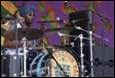 A person playing drums on stage

Description automatically generated with medium confidence