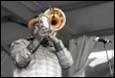 A person playing a trumpet

Description automatically generated with medium confidence