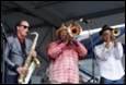 A group of men playing instruments

Description automatically generated with medium confidence