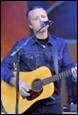 A person playing guitar and singing

Description automatically generated with low confidence