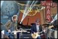 A group of men playing instruments on stage

Description automatically generated with medium confidence