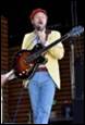 A person holding a guitar

Description automatically generated with medium confidence