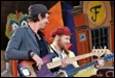A group of men playing guitars

Description automatically generated with low confidence
