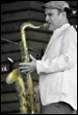 A person playing a saxophone

Description automatically generated with medium confidence
