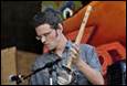 A person playing a guitar

Description automatically generated with medium confidence