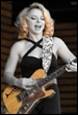 A picture containing musical instrument, person, concert, string instrument

Description automatically generated